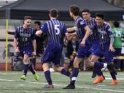 Heritage celebrates their first goal against Skyview during Tuesday night's soccer game at McKenzie Stadium in Vancouver on March 26, 2019.