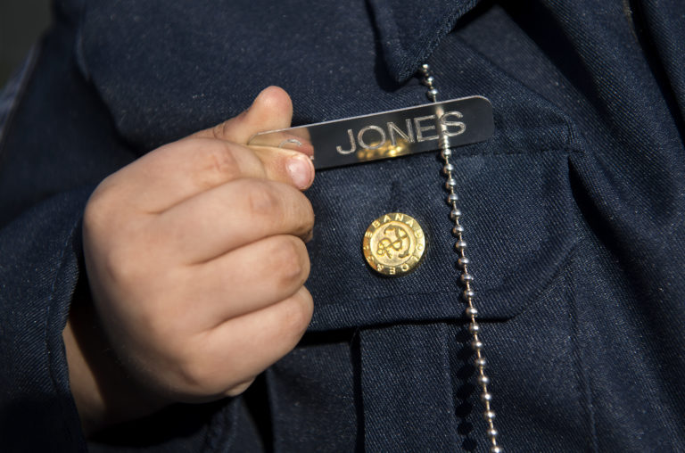 Clayton Jones, 4, sports a new police uniform complete with a name tag at the Vancouver Police Department East Precinct on Friday evening, March 29, 2019.