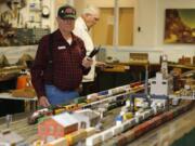 Jerry Jacobus operates trains at the Southwest Washington Model Railroaders open house on Saturday.