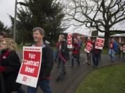 Clark College faculty and supporters prepare to make their way across campus during a Feb. 13 rally for a better contract. The college is convening a task force to consider staff reductions, which the union claims is related to their demands for pay increases.