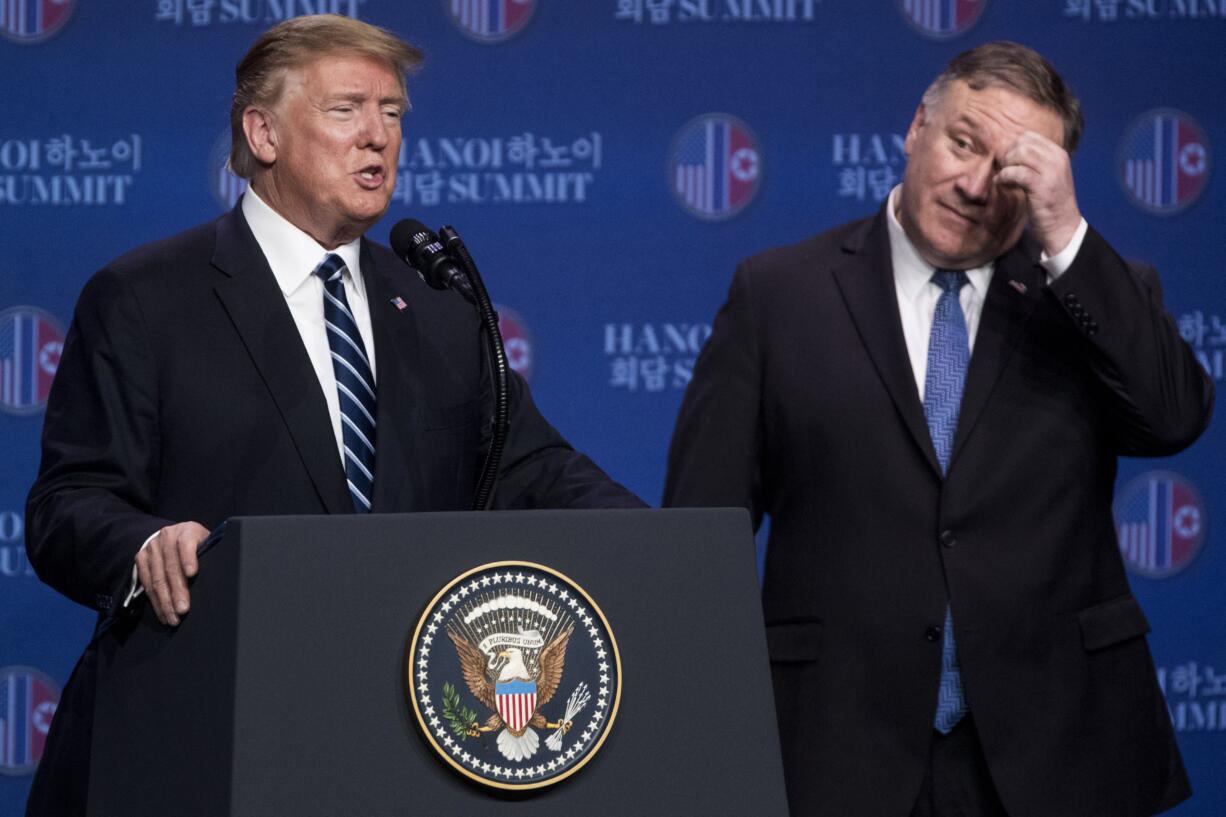 FILE - In this Thursday, Feb. 28, 2019, file photo, U.S. President Donald Trump accompanied by Secretary of State Mike Pompeo, right, speaks at a news conference in Hanoi, following talks with North Korean leader Kim Jong Un. Trump said he walked away from his second summit with North Korean leader Kim Jong Un because Kim demanded the U.S. lift all of its sanctions, a claim that North Korea's delegation called a rare news conference in the middle of the night to deny.