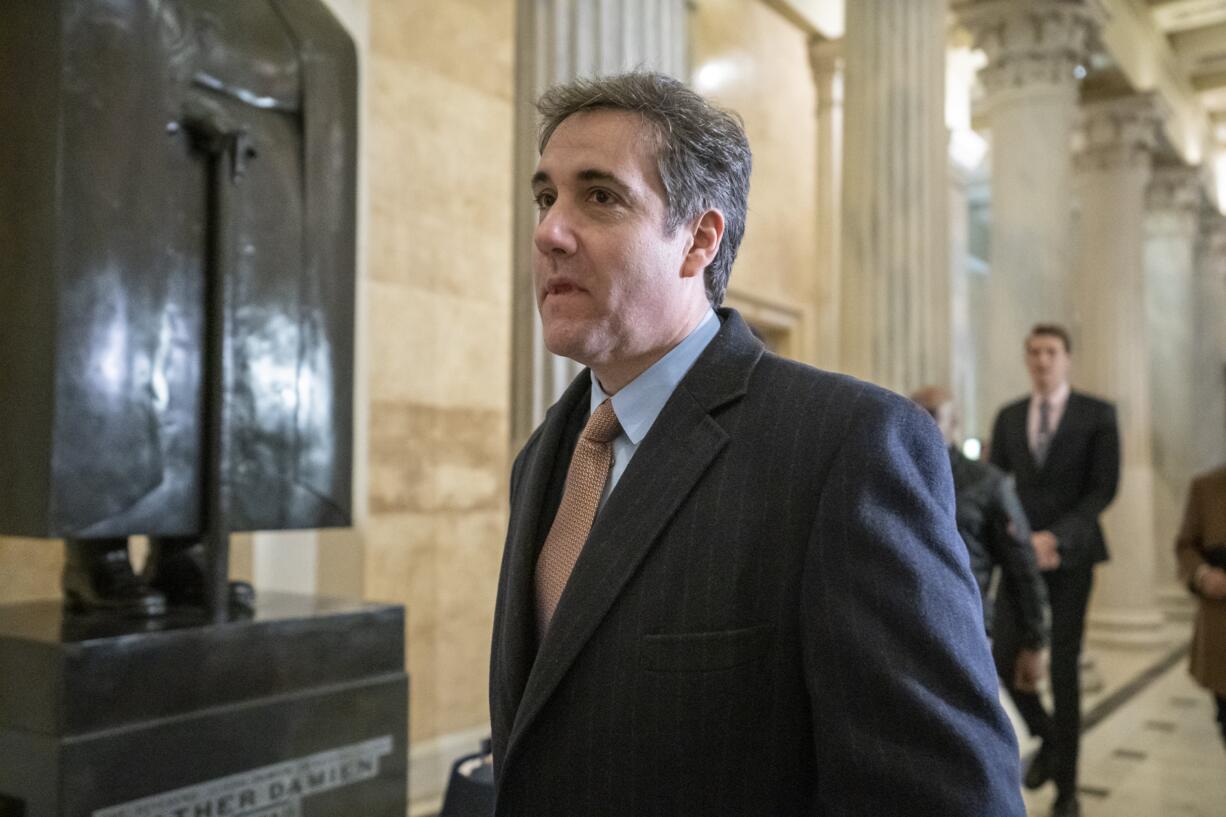 Michael Cohen, President Donald Trump's former lawyer, returns to Capitol Hill for a fourth day of testimony as Democrats pursue a flurry of investigations into Trump's White House, businesses and presidential campaign, in Washington, Wednesday, March 6, 2019. He appears today before the House Intelligence Committee. (AP Photo/J.