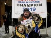 Peter Kaiser (9) poses with his lead dogs, Morrow, left, and Lucy., Wednesday, March 13, 2019, in Nome, Alaska, after winning the Iditarod Trail Sled Dog Race. It's the first Iditarod victory for Kaiser in his 10th attempt.