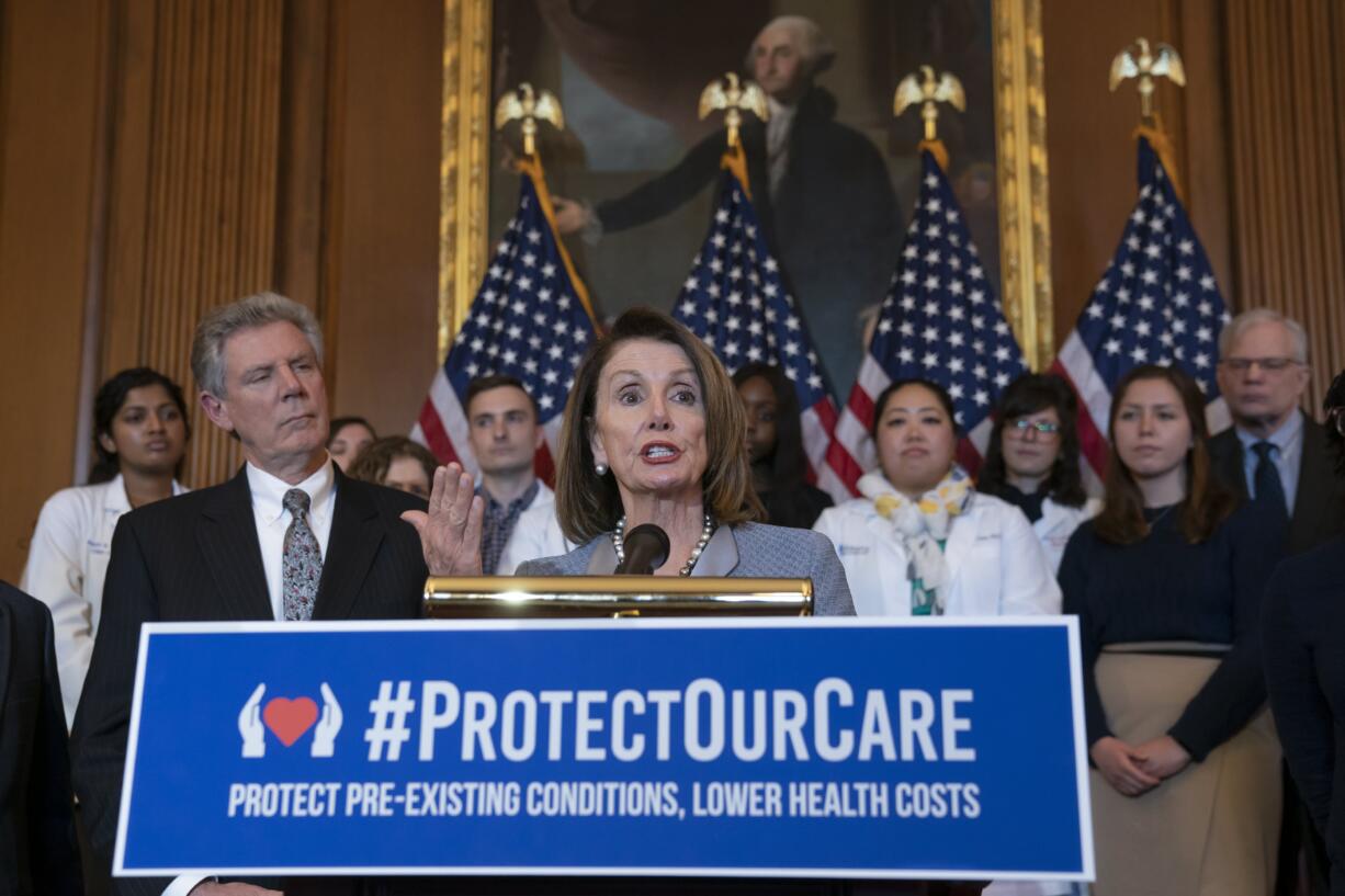 Speaker of the House Nancy Pelosi, D-Calif., joined at left by Energy and Commerce Committee Chair Frank Pallone, D-N.J., speaks at an event to announce legislation to lower health care costs and protect people with pre-existing medical conditions, at the Capitol in Washington, Tuesday, March 26, 2019. The Democratic action comes after the Trump administration told a federal appeals court that the entire Affordable Care Act, known as "Obamacare," should be struck down as unconstitutional. (AP Photo/J.