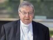 In this Dec 10, 2018, photo, Cardinal George Pell, the most senior Catholic cleric to face sex charges, departs an Australian court. Pell was sentenced in an Australian court on Wednesday, March 13, 2019 to 6 years in prison for molesting two choirboys in a Melbourne cathedral more than 20 years ago.