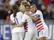 United States’ Tobin Heath, second from right, is congratulated on her goal by Mallory Pugh (11), Megan Rapinoe and Alex Morgan (13) during the first half of a SheBelieves Cup soccer match against Brazil Tuesday, March 5, 2019, in Tampa, Fla.