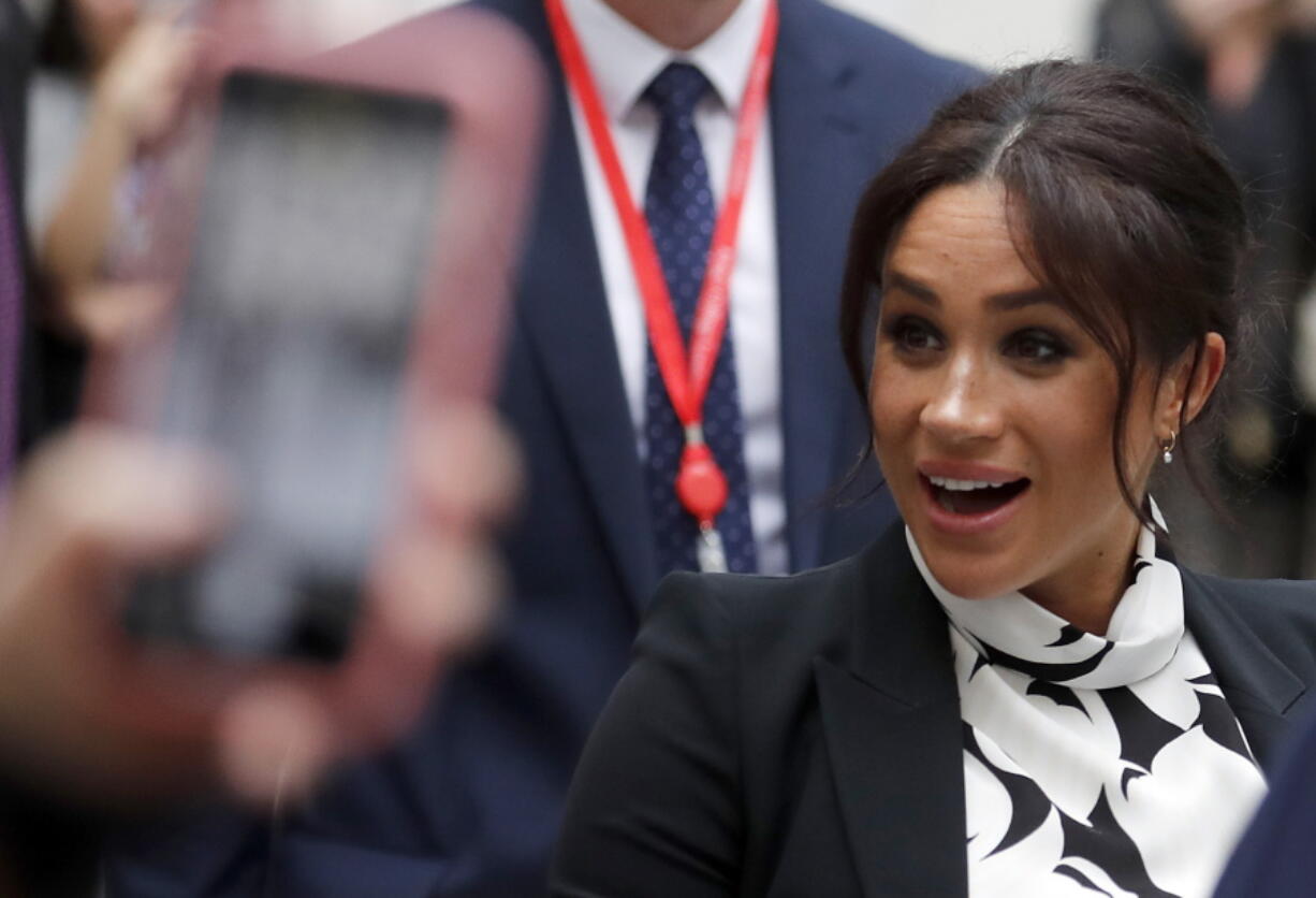 Britain’s Meghan, the Duchess of Sussex, leaves King’s College after joining a panel discussion convened by The Queen’s Commonwealth Trust to mark International Women’s Day in London, Friday, March 8, 2019.(AP Photo/Frank Augstein)