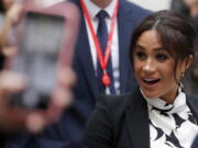 Britain’s Meghan, the Duchess of Sussex, leaves King’s College after joining a panel discussion convened by The Queen’s Commonwealth Trust to mark International Women’s Day in London, Friday, March 8, 2019.(AP Photo/Frank Augstein)