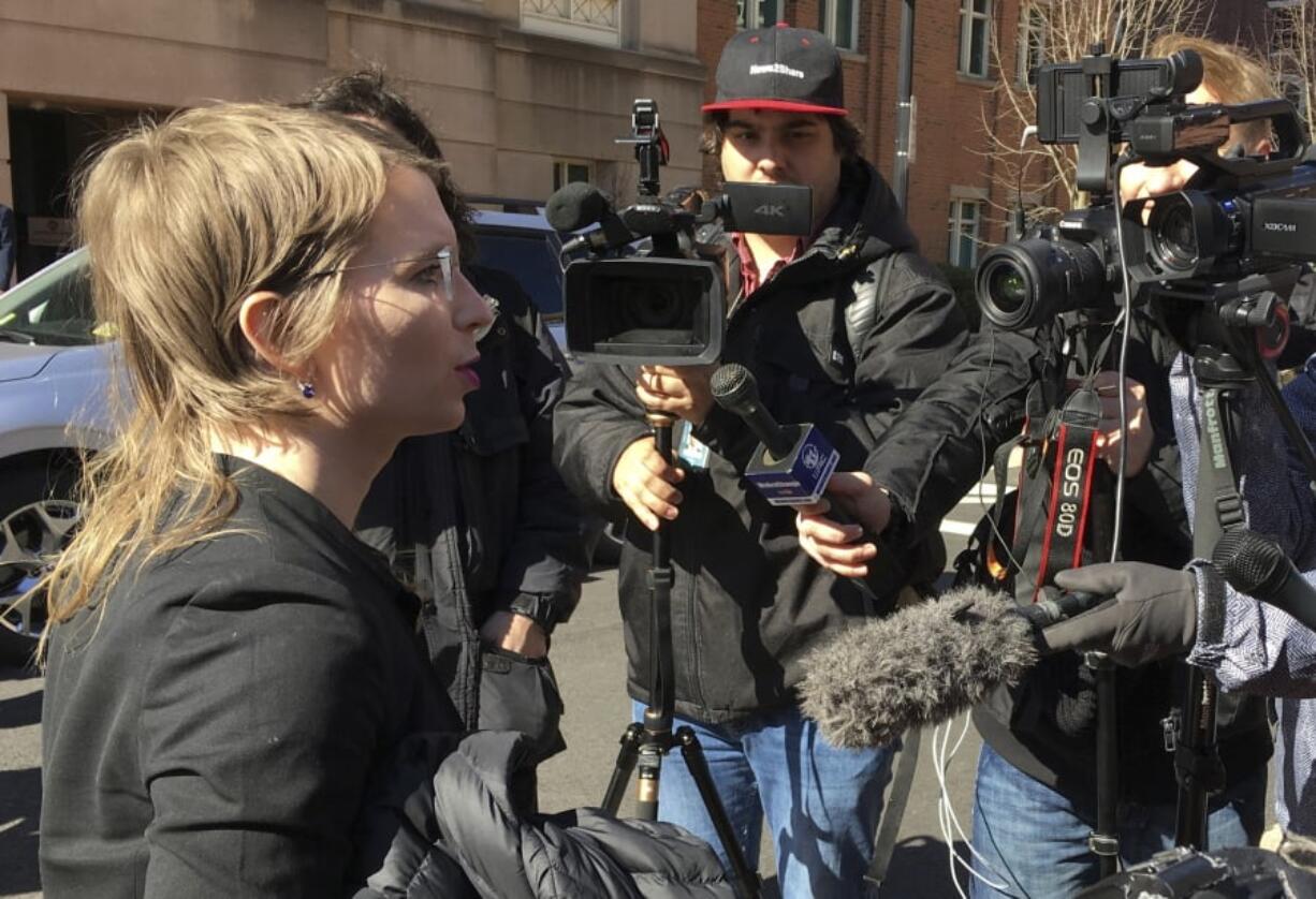 In this Tuesday, March 5, 2019 photo, Chelsea Manning addresses the media outside federal court in Alexandria, Va. The former Army intelligence analyst was ordered to jail Friday, March 8, 2019, for refusing to testify to a Virginia grand jury investigating Wikileaks.