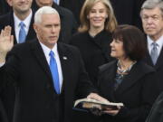 Karen Pence holds a Bible as her husband, Vice President Mike Pence, is sworn in during the 58th Presidential Inauguration on Jan. 20, 2017 at the U.S. Capitol in Washington.