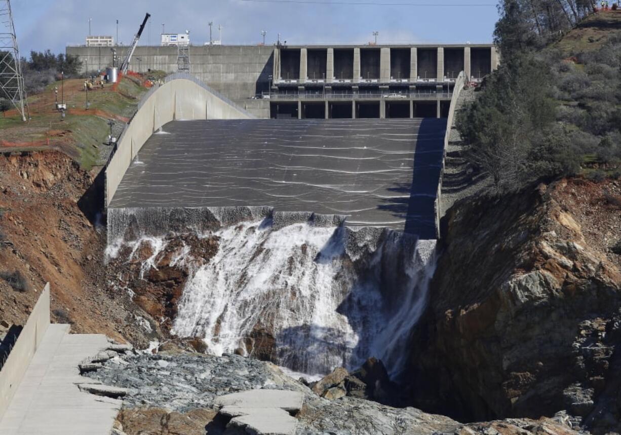 Water flows down the Oroville Dam’s crippled spillway Feb. 28, 2017, in Oroville, Calif. The spillway at the dam will be deployed this week.