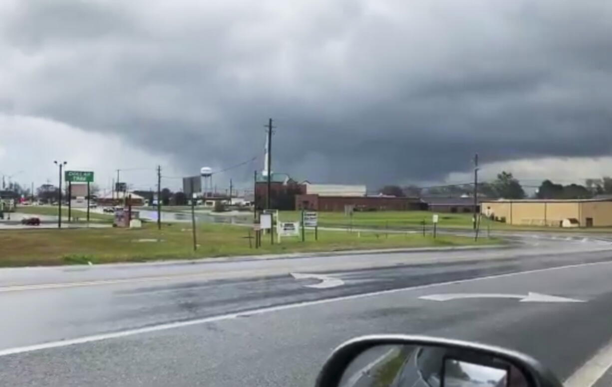 A funnel cloud in Byron, Ga., on Sunday. The National Weather Service issued a series of tornado warnings Sunday stretching from Phenix City, Ala., near the Georgia state line to Macon, Ga., about 100 miles to the east.