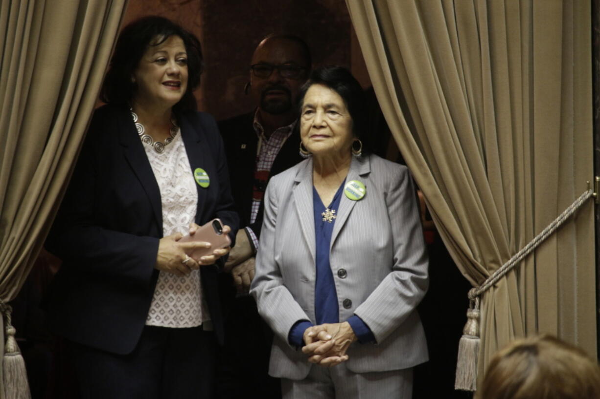 Dolores Huerta, right, watches as the Washington Senate discusses a measure to designate April 10 as “Dolores Huerta Day,” on Monday, March 18, 2019, in Olympia, Wash. The chamber unanimously passed the measure honoring Huerta, the Mexican-American social activist who formed a farmworkers union with Cesar Chavez.