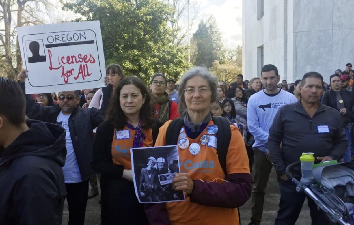 Immigrant rights advocates rally Tuesday at the Oregon state Capitol in Salem in favor of a measure that would expand driver’s license access to undocumented immigrants. Oregon lawmakers are considering the change as the state prepares to overhaul its identification system in compliance with federal law.