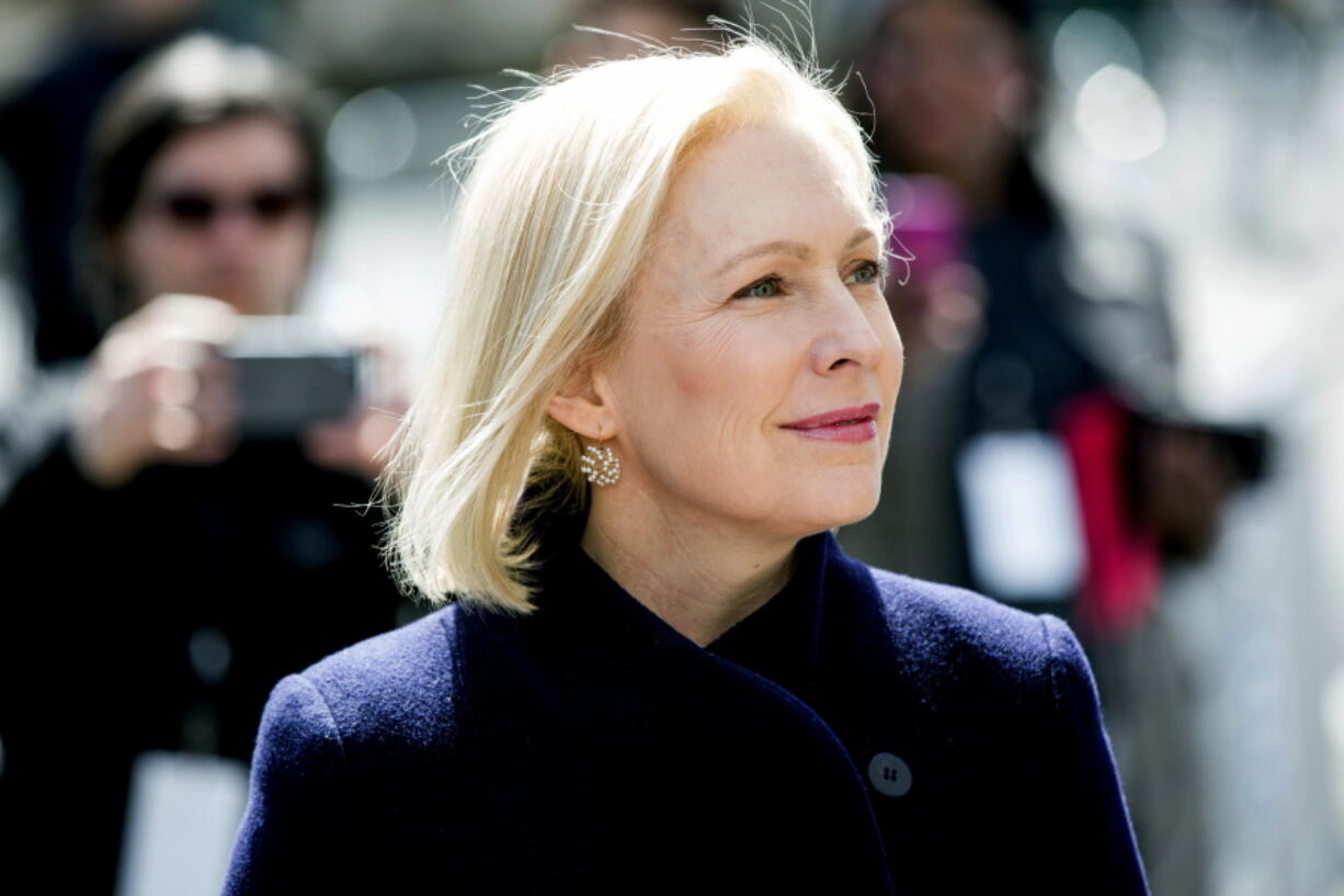 In this March 24, 2019 photo, Sen. Kirsten Gillibrand, D-N.Y., listens to actress Connie Britton speak before taking the stage to deliver a speech at the kickoff of her presidential campaign, in New York. Gillibrand has released her tax returns for 2018, showing she paid $29,170 in federal taxes on an income of $214,000.