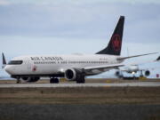 An Air Canada Boeing 737 MAX 8 aircraft departing for Calgary taxis to a runway at Vancouver International Airport in Richmond, British Columbia, on Tuesday.