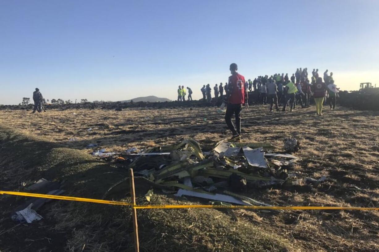 Rescuers search at the scene of an Ethiopian Airlines flight that crashed shortly after takeoff at the scene at Hejere near Bishoftu, or Debre Zeit, some 50 kilometers (31 miles) south of Addis Ababa, in Ethiopia Sunday, March 10, 2019. The Ethiopian Airlines flight crashed shortly after takeoff from Ethiopia’s capital on Sunday morning, killing all 157 on board, authorities said, as grieving families rushed to airports in Addis Ababa and the destination, Nairobi.