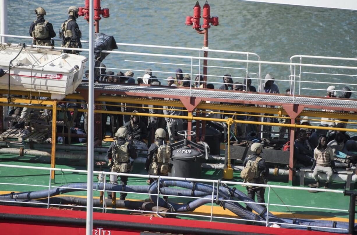 Armed forces stand onboard the Turkish oil tanker El Hiblu 1, which was hijacked by migrants, in Valletta, Malta, Thursday March 28, 2019. A Maltese special operations team on Thursday boarded a tanker that had been hijacked by migrants rescued at sea, and returned control to the captain, before escorting it to a Maltese port.