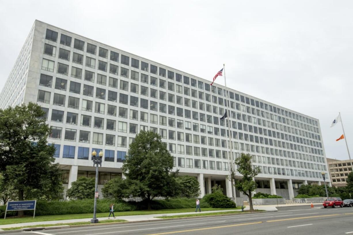 FILE - This Friday, June 19, 2015 file photo shows the Department of Transportation Federal Aviation Administration building, in Washington. For more than six decades, the Federal Aviation Administration has relied on employees of airplane manufacturers to do government-required safety inspections as planes are being designed or assembled. But critics say the system, dubbed the “Designee Program,” is too cozy as company employees do work for an agency charged with keeping the skies safe while being paid by an industry that the FAA is regulating.