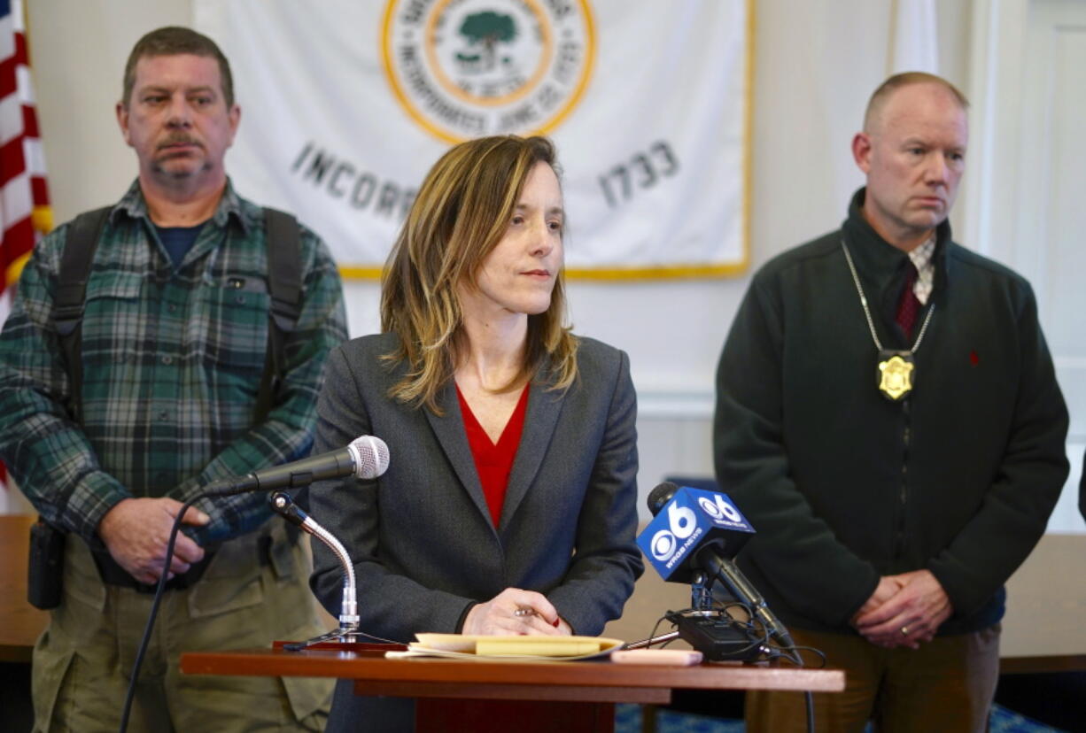 District Attorney Andrea Harrington, center, speaks during a news conference Wednesday, March 13, 2019, at Sheffield Town Hall about a house fire on Home Road that took the lives of five people in Sheffield, Mass. Behind Harrington are Sheffield Fire Chief Brent Getchell, left, and Massachusetts State Police Lt. Detective Ed Culver.