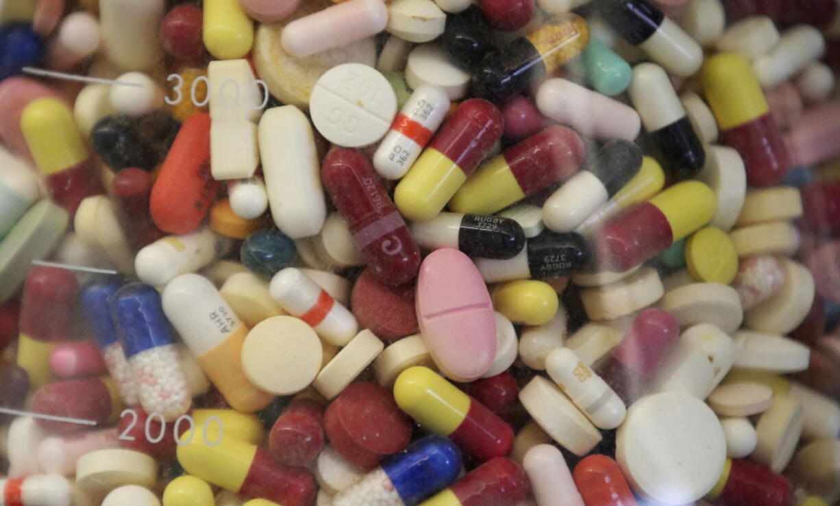 Prescription drugs in a glass flask at the state crime lab in Taylorsville, Utah.