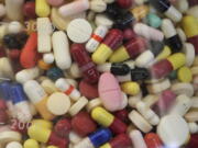 Prescription drugs in a glass flask at the state crime lab in Taylorsville, Utah.