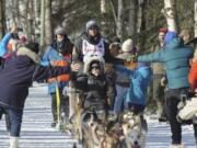 Defending Iditarod champion Joar Lefseth Ulsom, of Norway, greets fans on the trail during the ceremonial start of the Iditarod Trail Sled Dog Race Saturday, March 2, 2019 in Anchorage, Alaska.