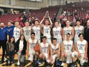 The La Center boys basketball team receives the fifth-place trophy at the 1A state basketball tournament on Saturday in Yakima.