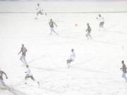 The Colorado Rapids play the Portland Timbers on a snow-covered pitch during the second half of an MLS soccer game Saturday, March. 2, 2019 in Commerce City, Colo.