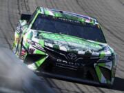 Kyle Busch drives during the early laps of the NASCAR Cup Series auto race at Auto Club Speedway, in Fontana, Calif., Sunday, March 17, 2019.