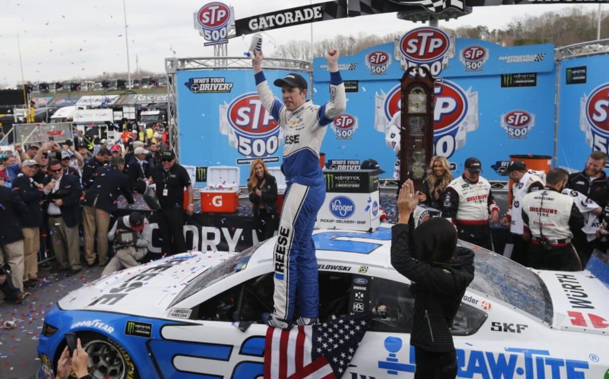 Brad Keselowski celebrates in Victory Lane after winning the NASCAR Cup Series auto race at Martinsville Speedway in Martinsville, Va., Sunday, March 24, 2019.