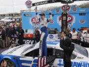 Brad Keselowski celebrates in Victory Lane after winning the NASCAR Cup Series auto race at Martinsville Speedway in Martinsville, Va., Sunday, March 24, 2019.