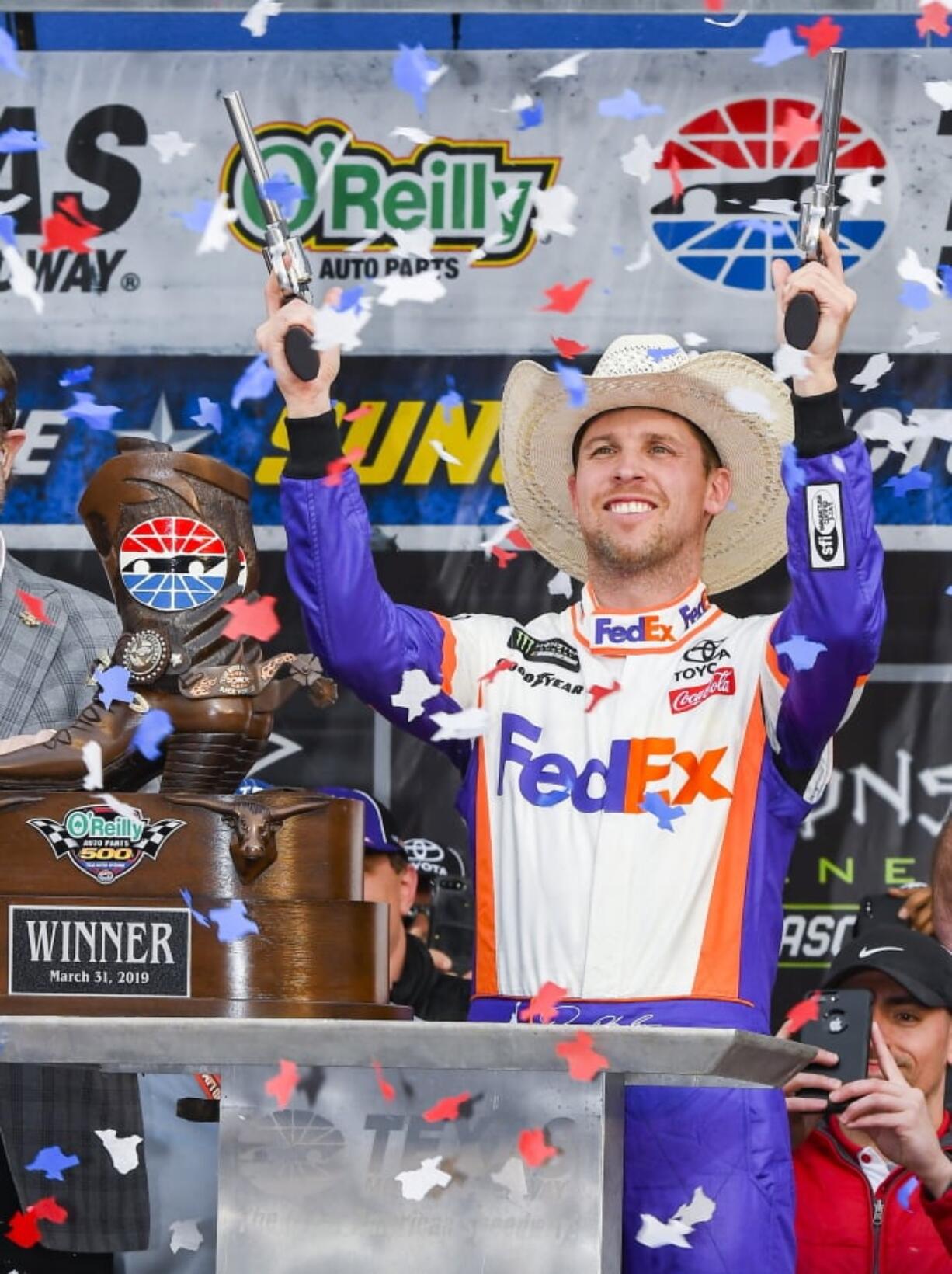 Drive Denny Hamlin celebrates in victory lane after winning a NASCAR Cup auto race at Texas Motor Speedway, Sunday, March 31, 2019, in Fort Worth, Texas.