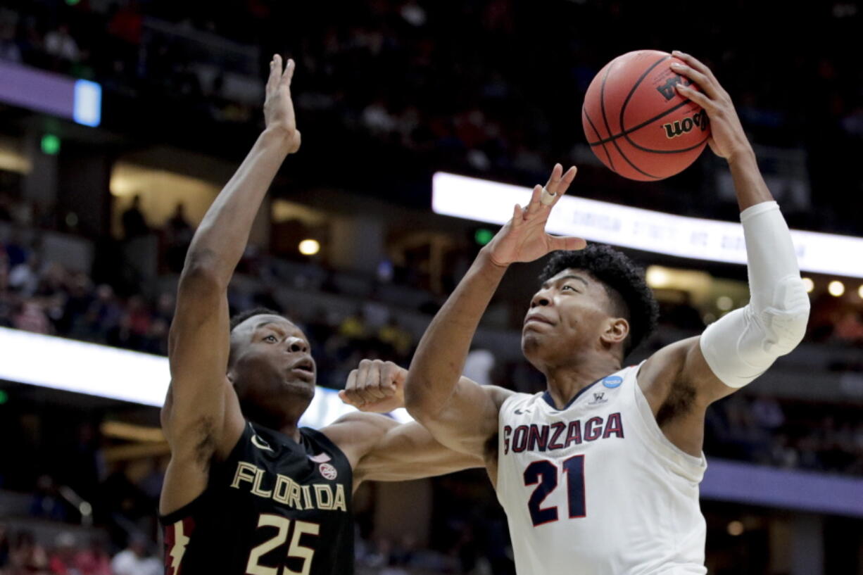 Gonzaga forward Rui Hachimura, right, shoots over Florida State forward Mfiondu Kabengele during the first half an NCAA men’s college basketball tournament West Region semifinal Thursday, March 28, 2019, in Anaheim, Calif. (AP Photo/Jae C.