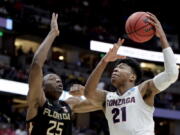 Gonzaga forward Rui Hachimura, right, shoots over Florida State forward Mfiondu Kabengele during the first half an NCAA men’s college basketball tournament West Region semifinal Thursday, March 28, 2019, in Anaheim, Calif. (AP Photo/Jae C.