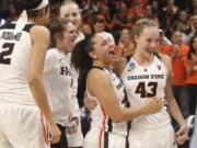 Oregon State’s Andrea Aquino, Kat Tudor, Joanna Grymek, Destiny Slocum and Jasmine Simmons, from left, celebrate the team’s 76-70 win over Gonzaga in a second-round game of the NCAA women’s college basketball tournament in Corvallis, Ore., Monday, March 25, 2019.