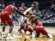 Oregon forward Ruthy Hebard (24), fights for a loose ball against Indiana guard Jaelynn Penn (13), during a second-round game of the NCAA women’s college basketball tournament Sunday, March 24, 2019, in Eugene, Ore.