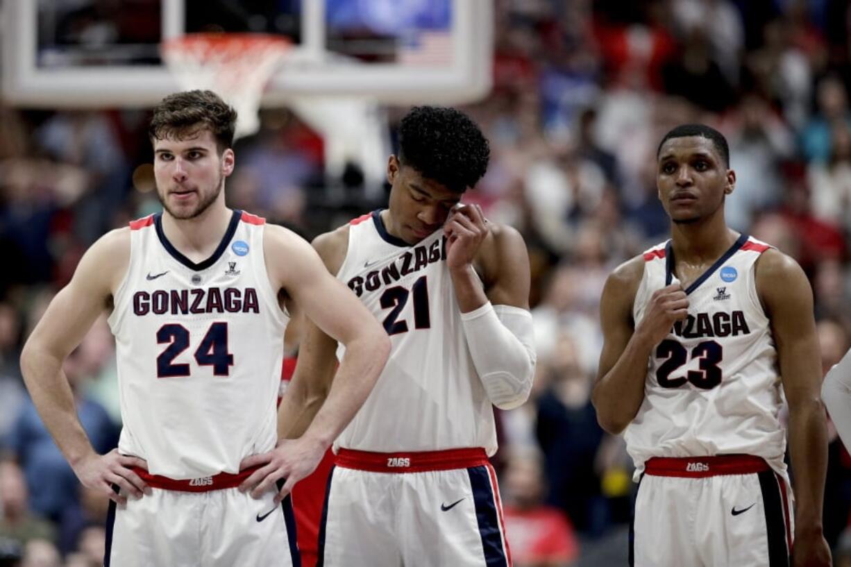 Gonzaga forward Corey Kispert, forward Rui Hachimura and guard Zach Norvell Jr., from left, stand on the court after the team’s loss to Texas Tech in the West Regional final in the NCAA men’s college basketball tournament Saturday, March 30, 2019, in Anaheim, Calif. Texas Tech won 75-69. (AP Photo/Jae C.