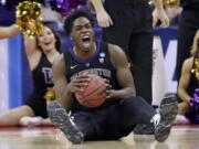 Washington’s Noah Dickerson (15) reacts after getting possession of the ball against Utah State in the first half during a first round men’s college basketball game in the NCAA Tournament in Columbus, Ohio, Friday, March 22, 2019.