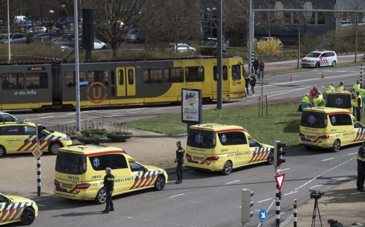 Ambulances are parked next to a tram after a shooting Monday in Utrecht, Netherlands.