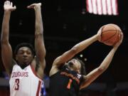 Oregon State guard Stephen Thompson Jr. (1) shoots while defended by Washington State forward Robert Franks Jr. (3) during the first half of an NCAA college basketball game in Pullman, Wash., Saturday, March 9, 2019.