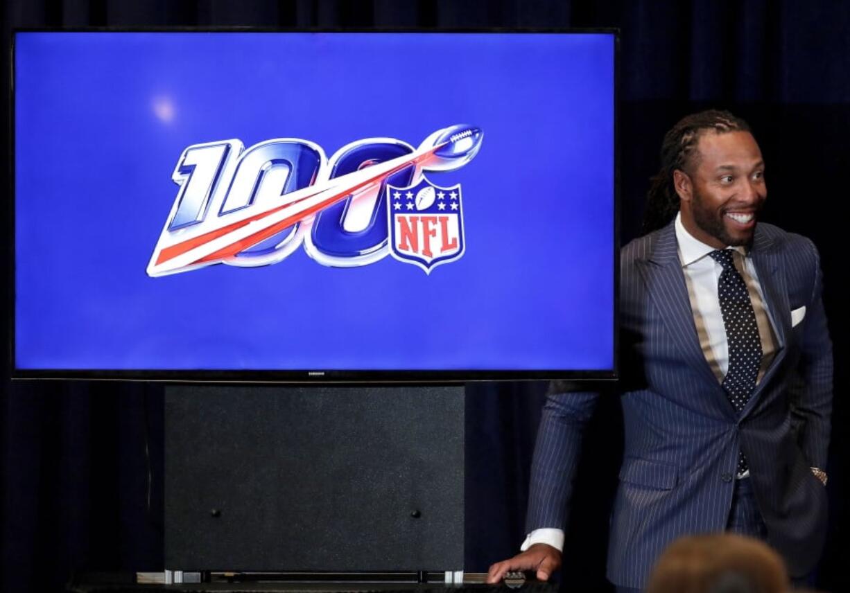 Arizona Cardinals’ Larry Fitzgerald listens during a news conference on social justice during the annual NFL football owners meetings, Monday, March 25, 2019, in Phoenix.