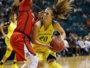 Oregon’s Sabrina Ionescu, right, drives around Arizona’s Tee Tee Starks during the second half of an NCAA college basketball game at the Pac-12 women’s tournament Friday, March 8, 2019, in Las Vegas.