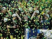 Oregon celebrates after defeating Washington 68-48 in an NCAA college basketball game in the final of the Pac-12 men’s tournament Saturday, March 16, 2019, in Las Vegas.