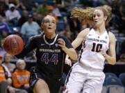 Washington’s Missy Peterson drives past Oregon State’s Katie McWilliams during the first half of an NCAA college basketball game at the Pac-12 women’s tournament Friday, March 8, 2019, in Las Vegas.