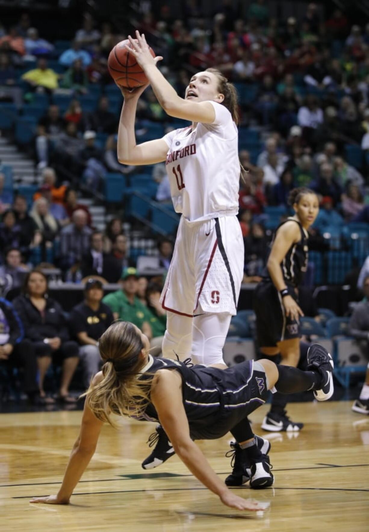 Stanford’s Alanna Smith drives into Washington’s Amber Melgoza during the second half of an NCAA college basketball game in the semifinals of the Pac-12 women’s tournament Saturday, March 9, 2019, in Las Vegas.