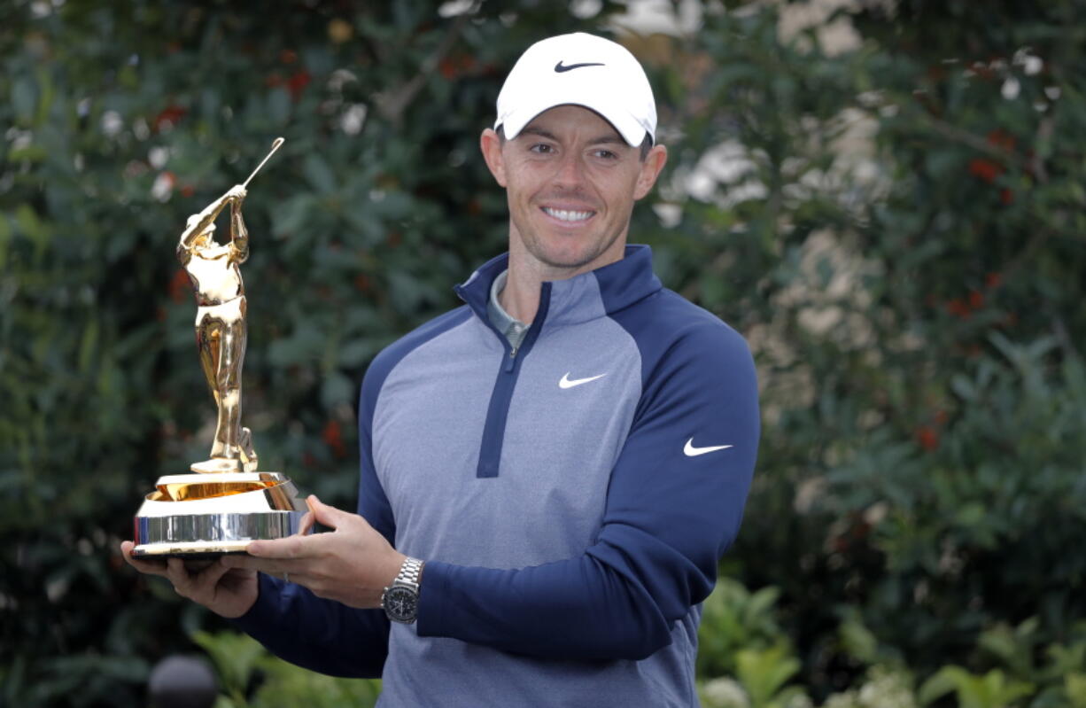 Rory McIlroy, of Northern Ireland, holds the trophy after winning The Players Championship golf tournament Sunday, March 17, 2019, in Ponte Vedra Beach, Fla.