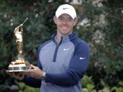 Rory McIlroy, of Northern Ireland, holds the trophy after winning The Players Championship golf tournament Sunday, March 17, 2019, in Ponte Vedra Beach, Fla.