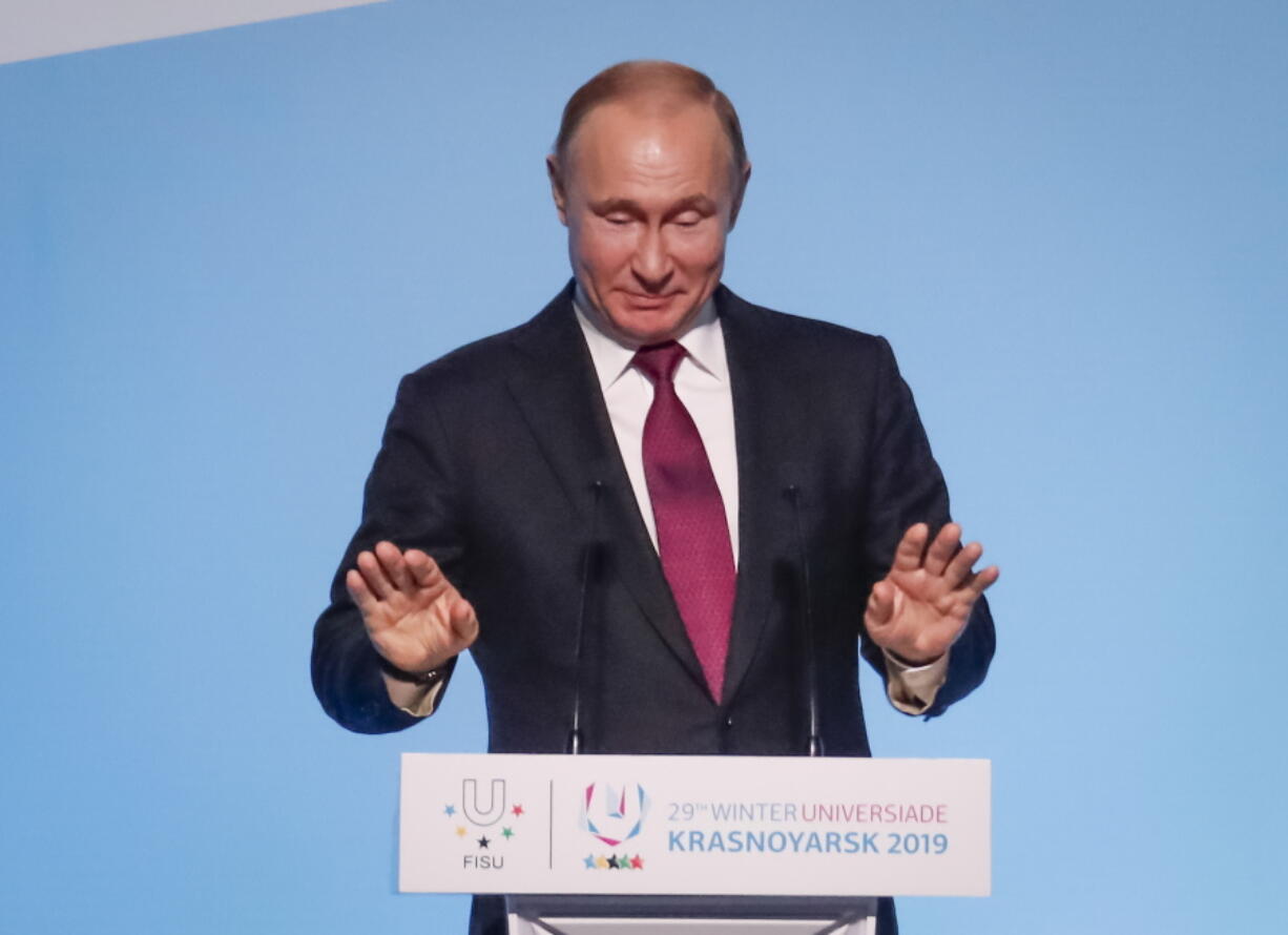 Russian President Vladimir Putin gestures while speaking during the opening ceremony for the 29th Winter Universiade games at the Platinum Arena in Krasnoyarsk, Russia, Saturday, March 2, 2019.