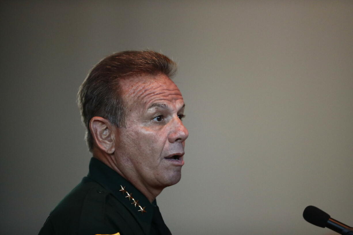 FILE - In this Thursday, Nov. 15, 2018, file photo, Broward County Sheriff Scott Israel speaks before the state commission in Sunrise, Fla. Israel, who was suspended by the governor and accused of failing to prevent the Parkland school shooting filed suit Thursday, March 7, 2019, seeking his job back and alleging Gov. Ron DeSantis improperly ousted him for political reasons.